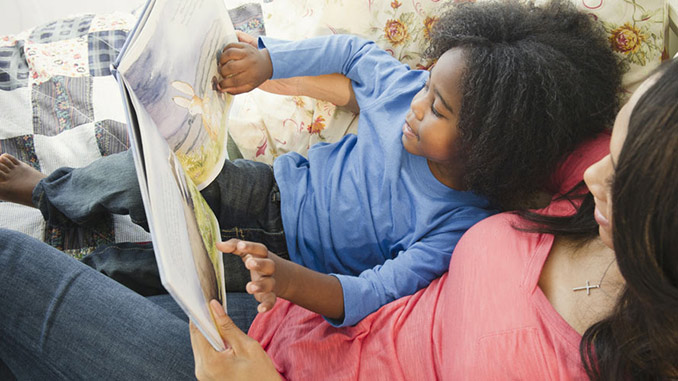 Woman-And-Child-Reading-Book Woman-And-Child-Reading-Book
