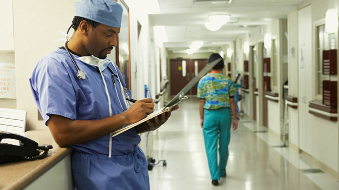 Disability_Income_Doctor_Writing_Notes Disability_Income_Doctor_Writing_Notes